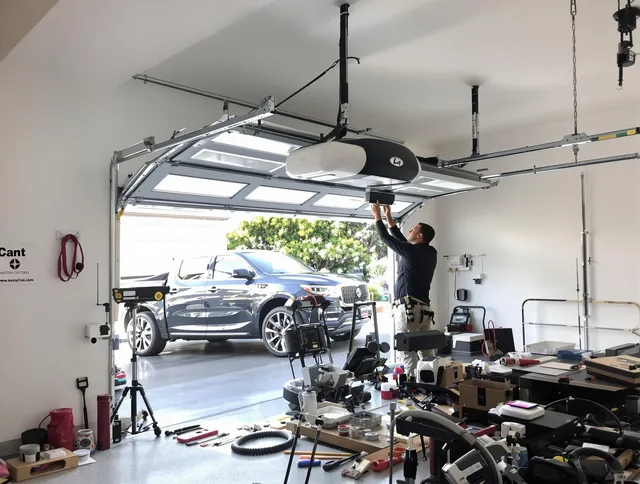 Tolland Garage Door Repair specialist installing smart garage door opener system in Tolland home