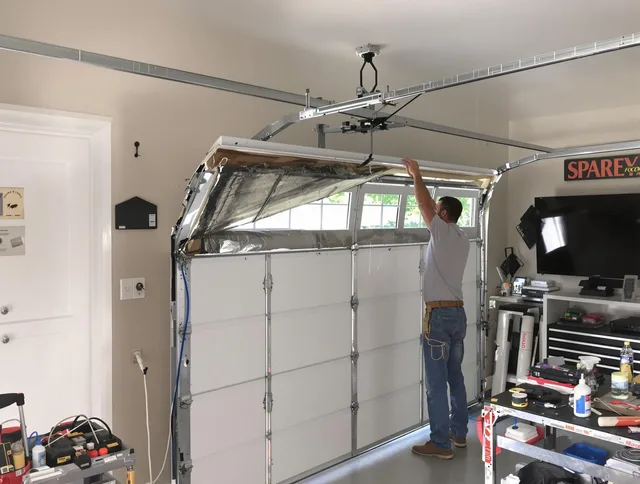 Garage door section replacement by Tolland Garage Door Repair in Tolland