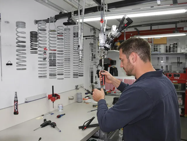 Tolland Garage Door Repair safety certified technician performing precision spring replacement in Tolland